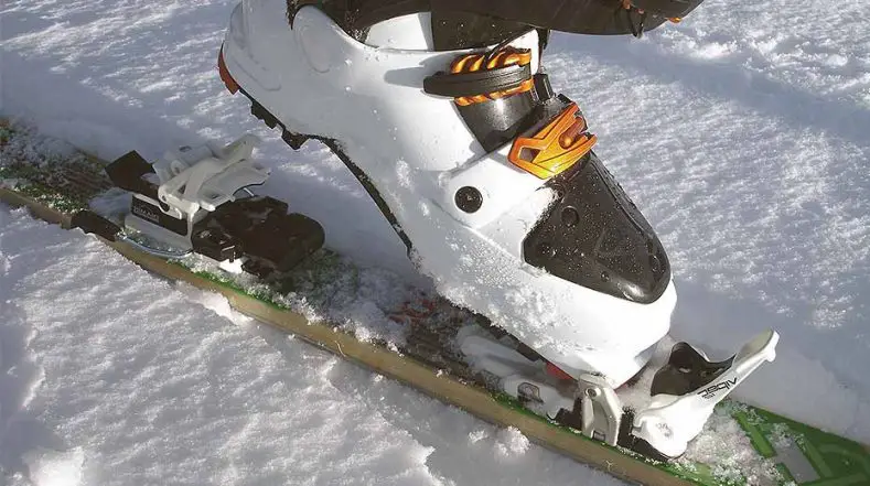 Ski boot with technical touring ski binding