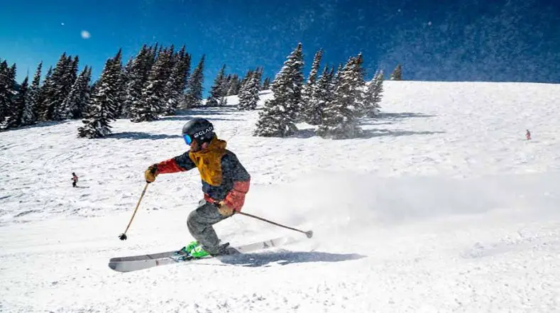 Skier in a blue slope