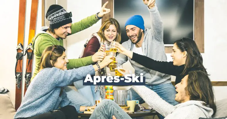 Après Ski, friends toast with drinks and ski gear on at after-ski.